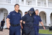 Pegawai kanan polis Deputi Superintenden Mohd Nazri Abdul Razak didakwa menyebabkan kematian terhadap Muhammad Zaharif Affendi Muhd Zamrie, 17.