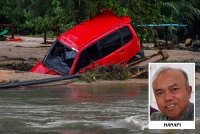 Keadaan terkini Jalan Kampung Tujuh berdekatan Taman Sri Bayu yang terputus hubungan sepanjang 60 meter akibat arus deras dalam kejadian banjir yang berlaku. Foto Bernama 