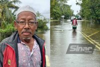 Yuti (kiri), Yuti membawa dedak haiwan dalam banjir di Kampung Ana, Tumpat. FOTO SINAR HARIAN/ADILA SHARINNI WAHID