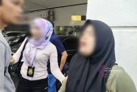 Wanita warga asing mengaku sebagai warga tempatan untuk meloloskan diri ketika diperiksa JIM Johor di Taman Tampoi Indah, Johor Bahru - Foto JIM Johor