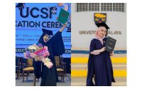 Bella Berhaman bersama dua ijazah yang diterimanya untuk tahun 2024 iaitu daripada Universiti Malaya dan University College Sabah Foundation (UCSF).