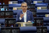 Fahmi ketika sesi penggulungan Rang Undang-undang (RUU) Suruhanjaya Komunikasi Multimedia SKMM (pindaan) 2024 pada persidangan Dewan Rakyat di Bangunan Parlimen pada Selasa. Foto Bernama