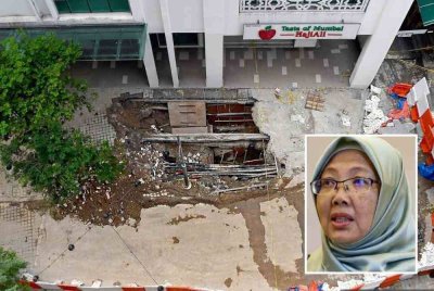 Kerja-kerja pembaikan di kawasan ground zero insiden lubang benam di depan Wisma Melayu di sini dijangka selesai pada hujung bulan ini. Foto Bernama. Gambar kecil: Zaliha