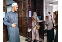 Muhammad &#039;Athoullah, Ummu Habibah, ketika keluar dari Mahkamah Tinggi Syariah Melaka di sini, pada Khamis.