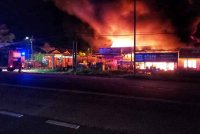 Kebakaran di sebuah kedai perkakasan di Jalan Sungai Soi Pekan-Kuantan awal pagi Sabtu. Foto ihsan JBPM