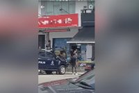 Tangkap layar video tular lokasi seorang lelaki ditembak di sebuah restoran di Taman Setia Indah Johor Bahru pada Rabu.