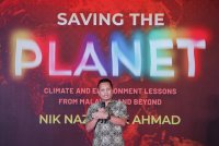 Nik Nazmi berucap semasa melancarkan buku beliau berjudul ‘Saving the Planet: Climate and Environmental Lessons from Malaysia and Beyond’ di sini pada Sabtu. Foto Bernama