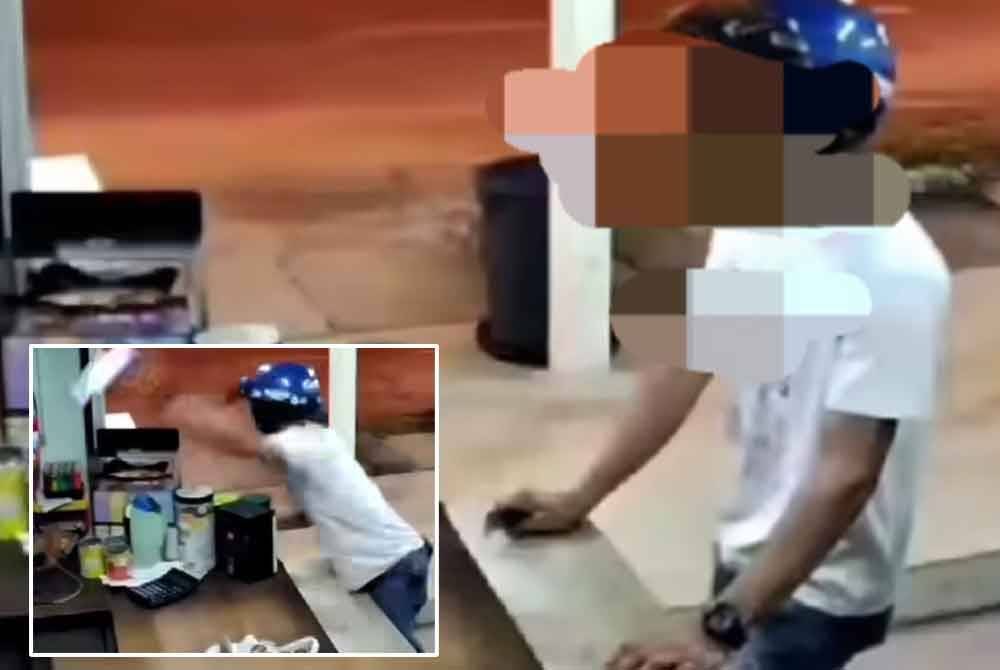 Tangkap layar video memaparkan suspek dipercayai mencuri sebuah telefon bimbit di sebuah kedai.