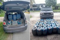 Cubaan dua lelaki menyeludup lebih 900 liter petrol bernilai RM3,029.50 ke Thailand gagal selepas kereta dinaiki mereka ditahan anggota Batalion 8 Pasukan Gerakan Am (PGA) Pengkalan Chepa di Chabang Empat, Tumpat Isnin. - Foto: PGA