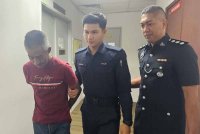 Mohd Saffuan dihadapkan ke Mahkamah Majistret Ipoh pada Selasa atas pertuduhan mengedar dadah jenis heroin seberat 19.2kg, minggu lalu.